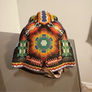 Huichol beaded jaguar made of seed beads on bees wax and wood